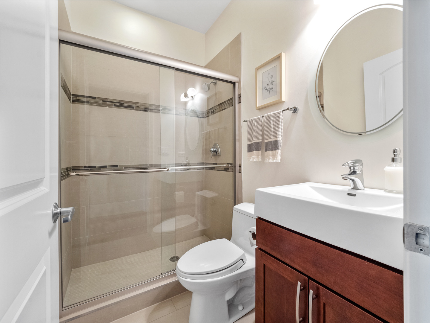 1925 West Irving Park Road, Unit 3 Chicago, IL 60613 - Photo 14 of 26 a bathroom with a sink toilet and a mirror
