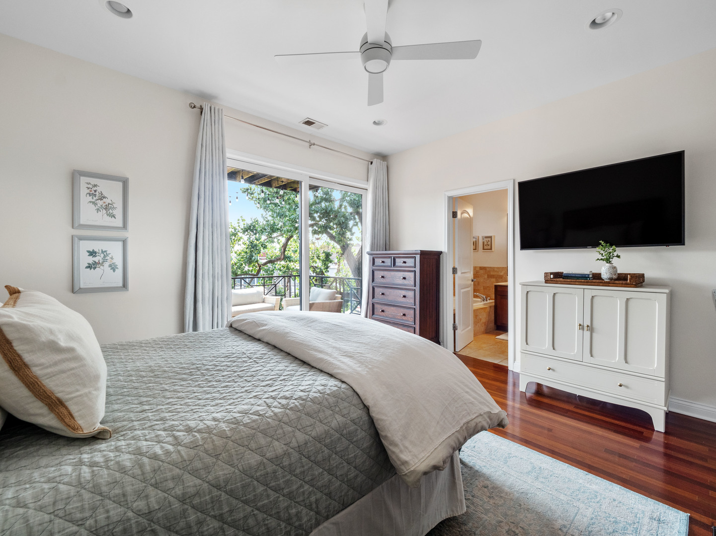 1925 West Irving Park Road, Unit 3 Chicago, IL 60613 - Photo 17 of 26 a bedroom with a bed and a flat screen tv