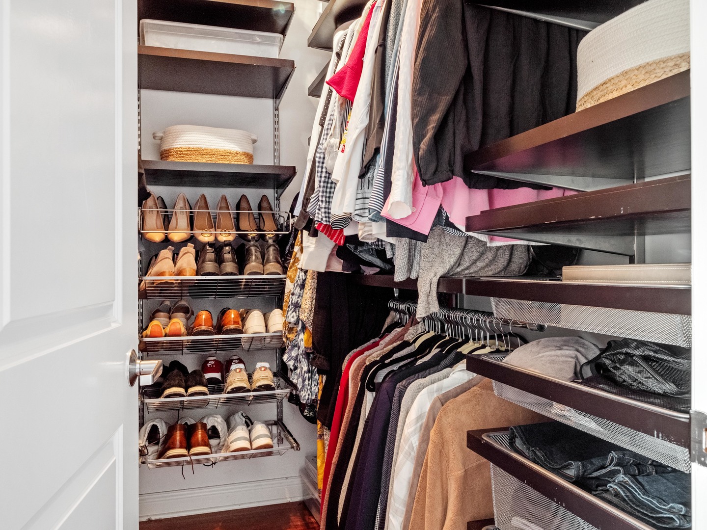 1925 West Irving Park Road, Unit 3 Chicago, IL 60613 - Photo 20 of 26 a view of walk in closet with clothes and shoes