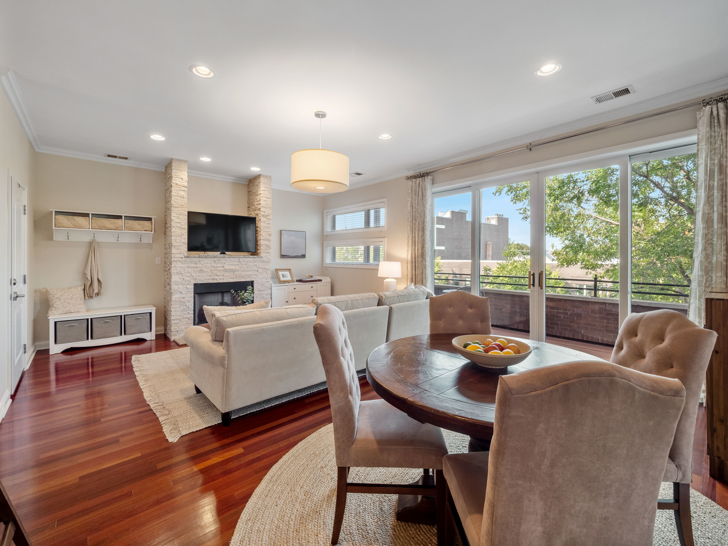 1925 West Irving Park Road, Unit 3 Chicago, IL 60613 - Photo 5 of 26 a living room with fireplace furniture and a large window