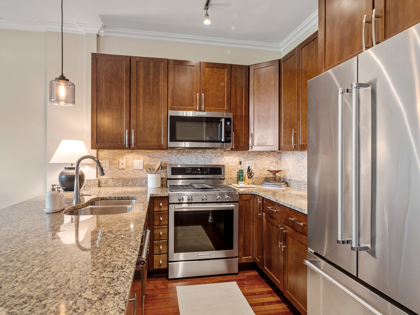 1925 West Irving Park Road, Unit 3 Chicago, IL 60613 - Photo 7 of 26 a kitchen with a refrigerator stove and sink