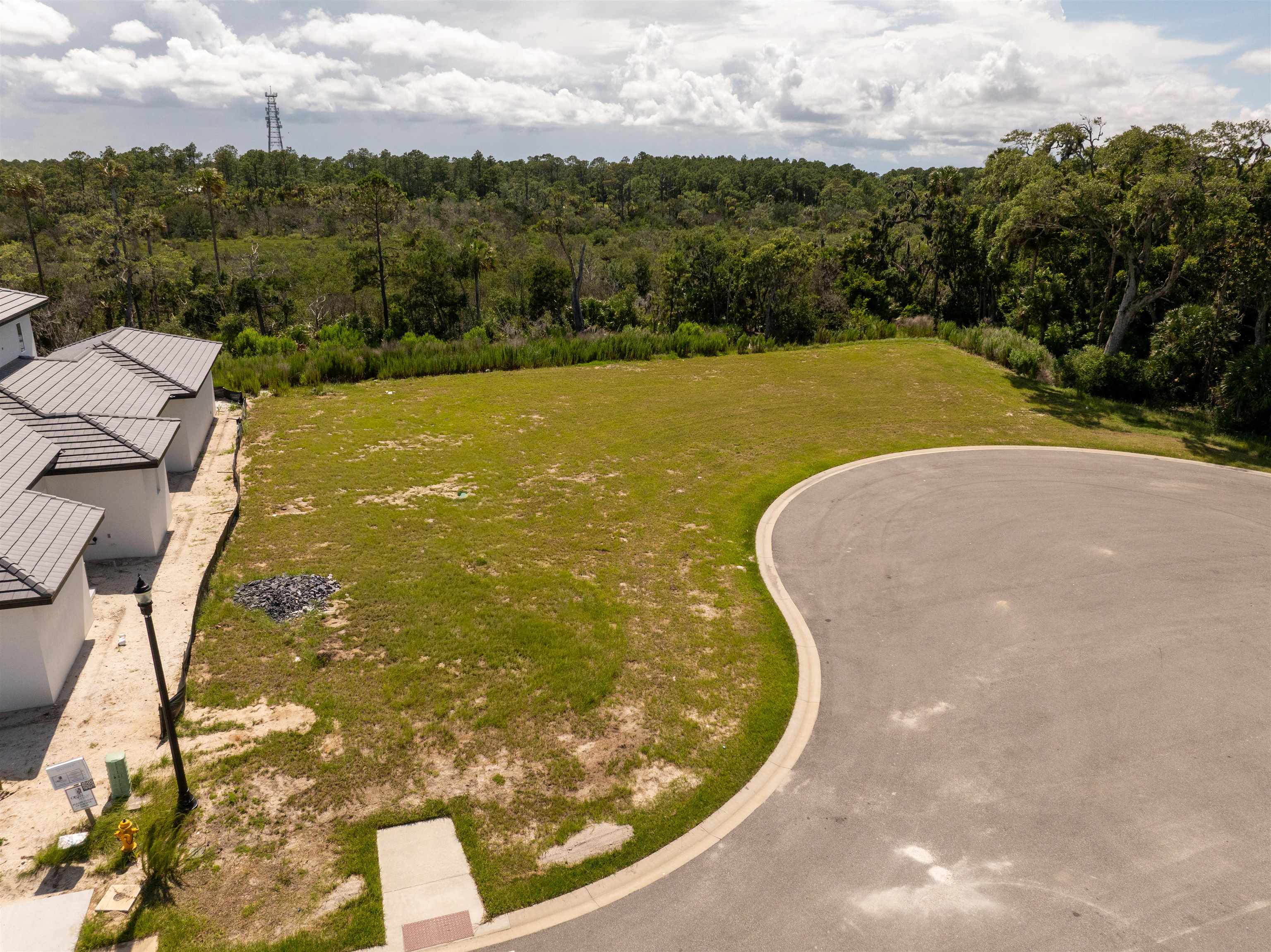 5 Coronado Road Flagler Beach, FL 32136 - Photo 11 of 18 a view of a swimming pool with a yard