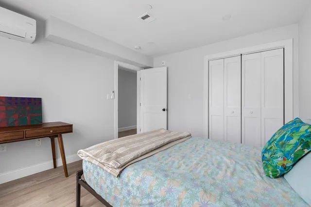 a bedroom with a bed and a table in it