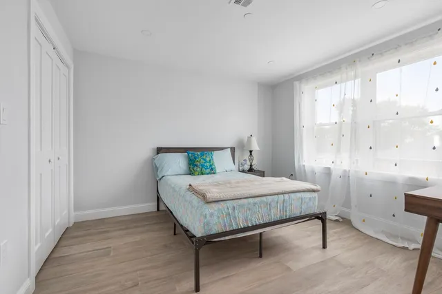 a bedroom with a bed and a table in it