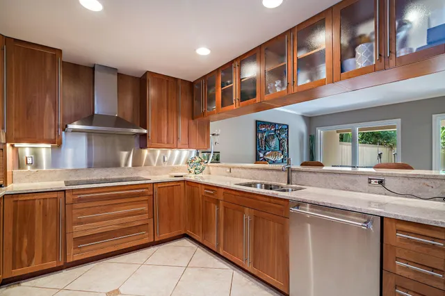 a kitchen with a sink and cabinets