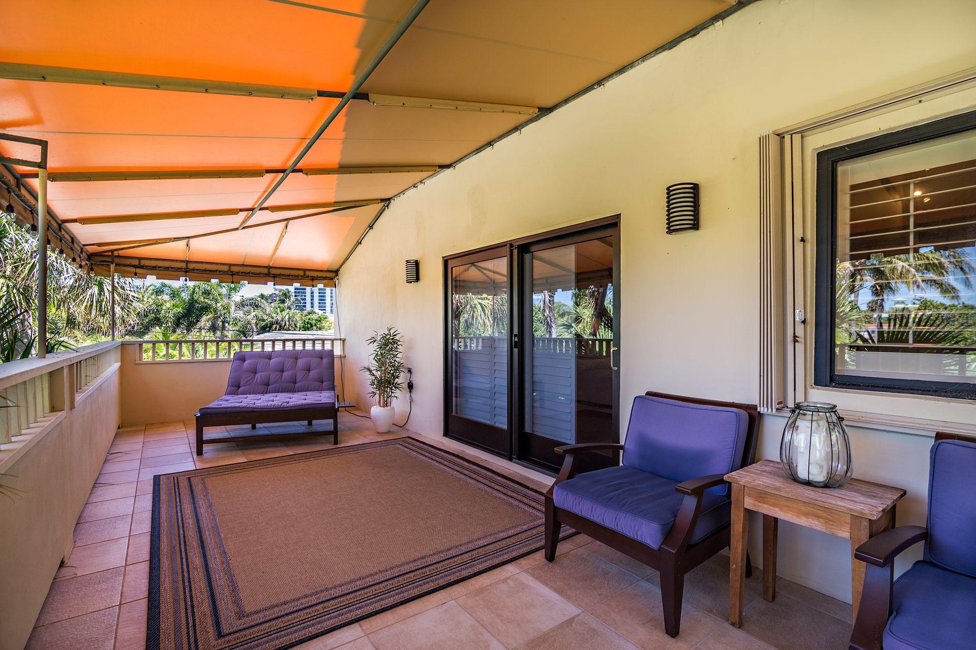 220 Celestial Way, Unit 1 Juno Beach, FL 33408 - Photo 22 of 35 a outdoor living space with furniture and a garden