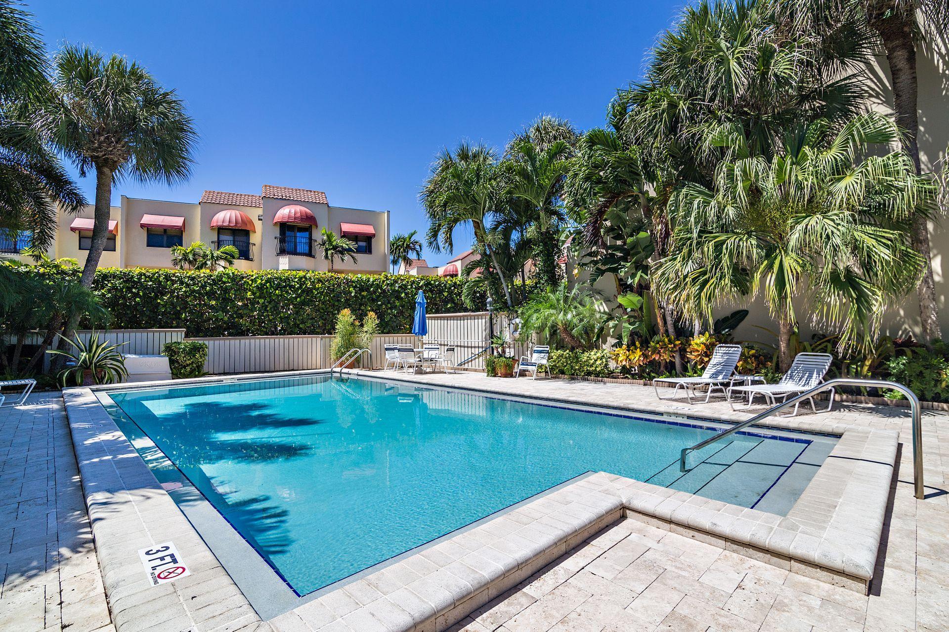 220 Celestial Way, Unit 1 Juno Beach, FL 33408 - Photo 9 of 35 a view of a house with swimming pool and sitting area