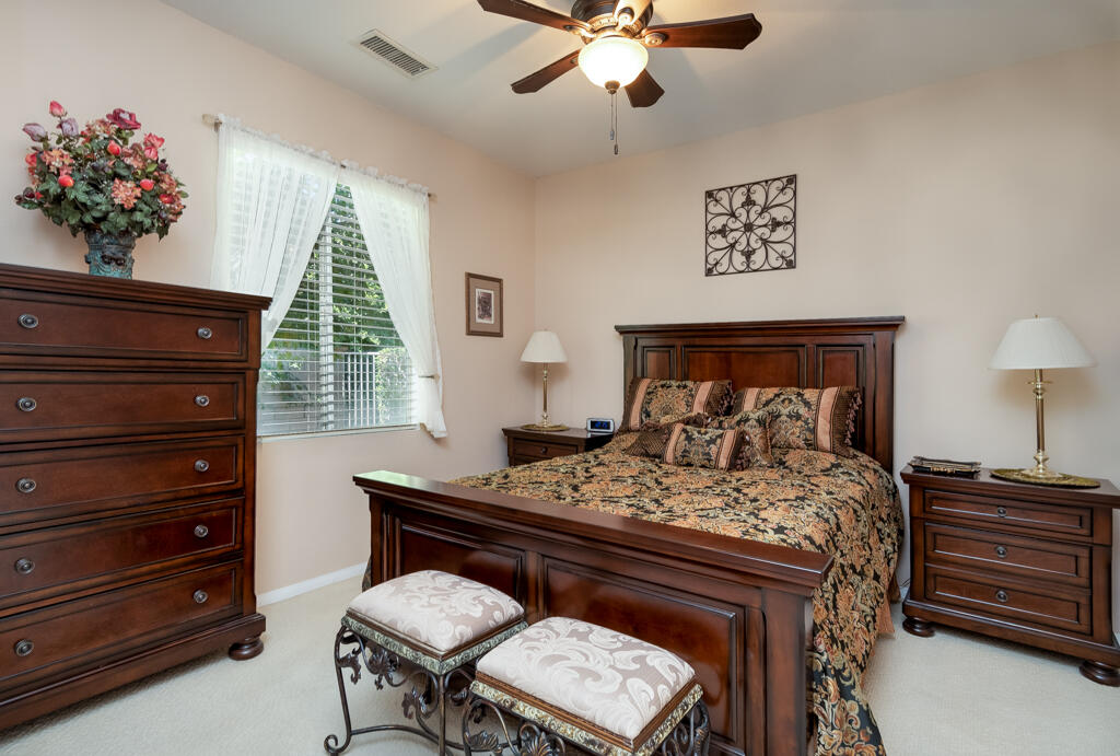 82539 Grant Drive Indio, CA 92201 - Photo 13 of 34 a bed room with a bed and a dresser