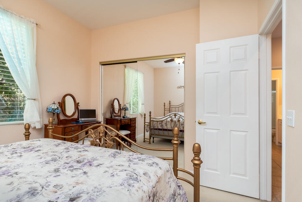 82539 Grant Drive Indio, CA 92201 - Photo 17 of 34 a bed room with a bed and a chair