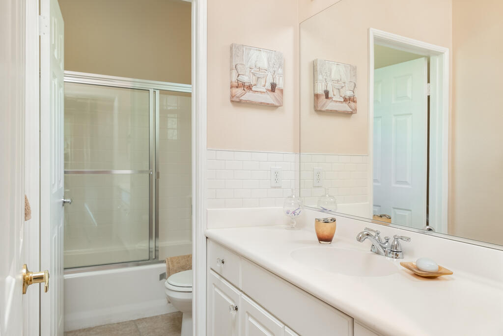 82539 Grant Drive Indio, CA 92201 - Photo 19 of 34 a bathroom with a sink a toilet and shower