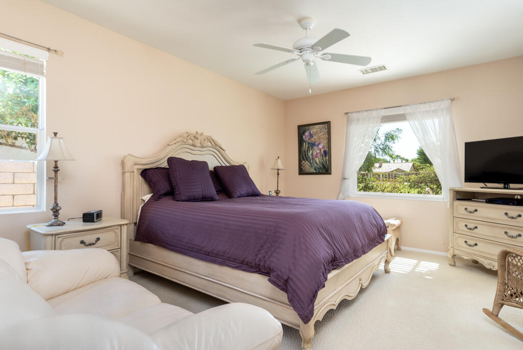 82539 Grant Drive Indio, CA 92201 - Photo 21 of 34 a bedroom with a bed flat screen tv and a window