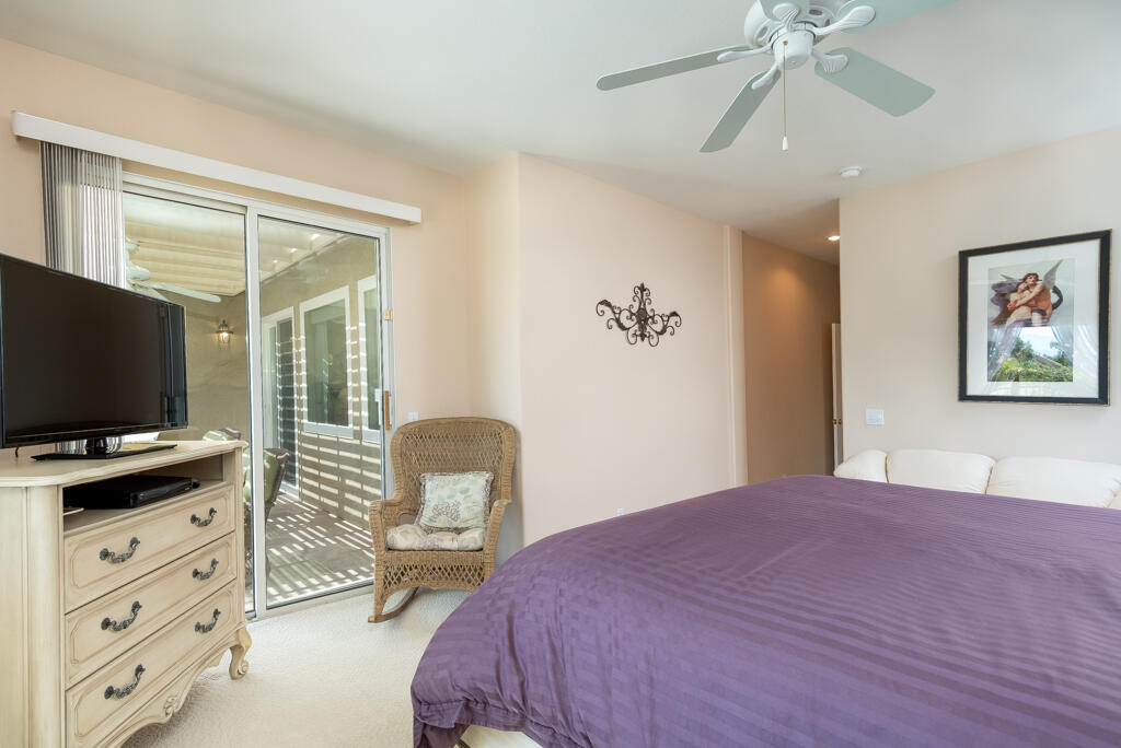 82539 Grant Drive Indio, CA 92201 - Photo 22 of 34 a bedroom with a bed and a flat screen tv