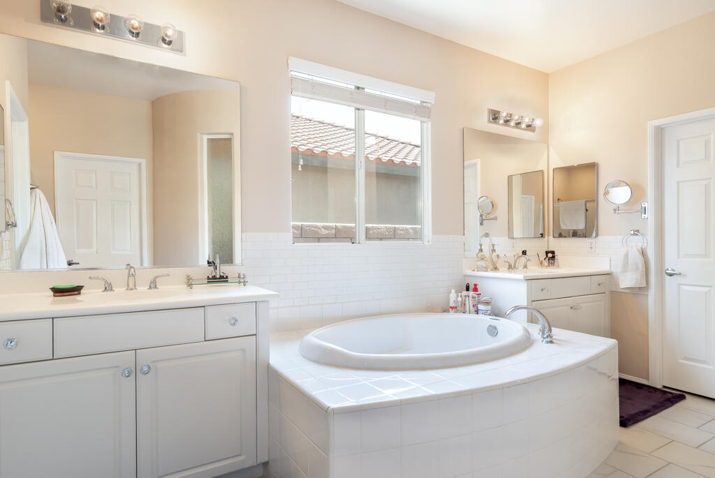 82539 Grant Drive Indio, CA 92201 - Photo 24 of 34 a bathroom with double sink and a mirror