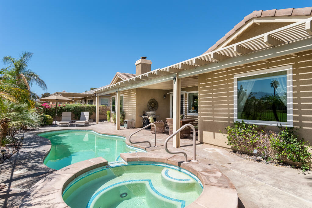 82539 Grant Drive Indio, CA 92201 - Photo 28 of 34 a house view with a seating space and garden view