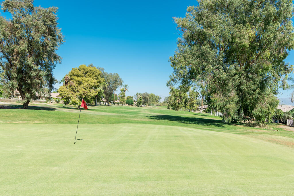 82539 Grant Drive Indio, CA 92201 - Photo 30 of 34 a view of a golf course with a lake