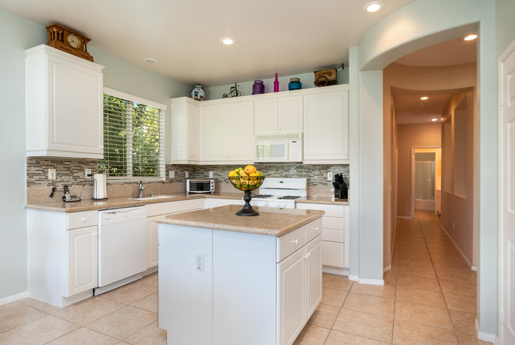82539 Grant Drive Indio, CA 92201 - Photo 6 of 34 a kitchen with sink cabinets and window