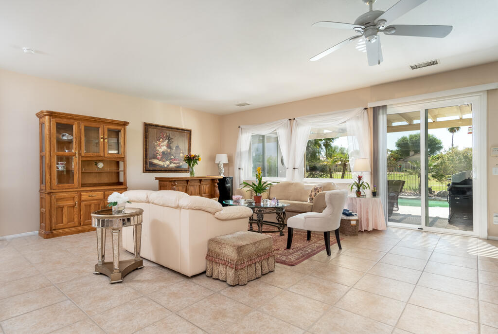 82539 Grant Drive Indio, CA 92201 - Photo 9 of 34 a living room with furniture and a large window