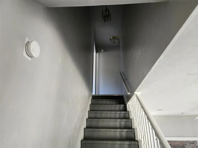 a view of hallway with wooden floor