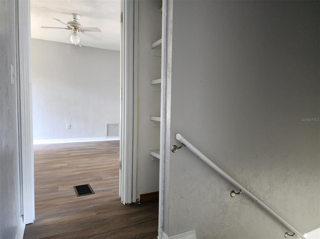 10911 Northwest 31st Place Gainesville, FL 32606 - Photo 17 of 27 a view of hallway with wooden floor