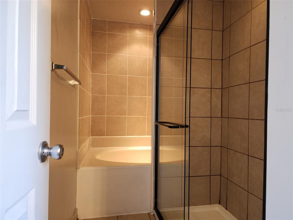 10911 Northwest 31st Place Gainesville, FL 32606 - Photo 19 of 27 a bathroom with a shower