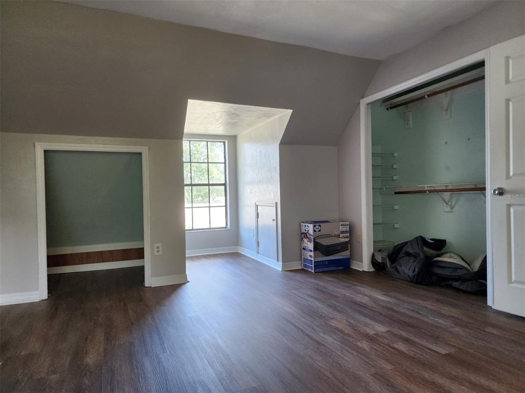 10911 Northwest 31st Place Gainesville, FL 32606 - Photo 22 of 27 a view of a livingroom with furniture and a window