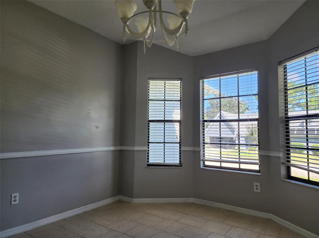 10911 Northwest 31st Place Gainesville, FL 32606 - Photo 9 of 27 an empty room with a window