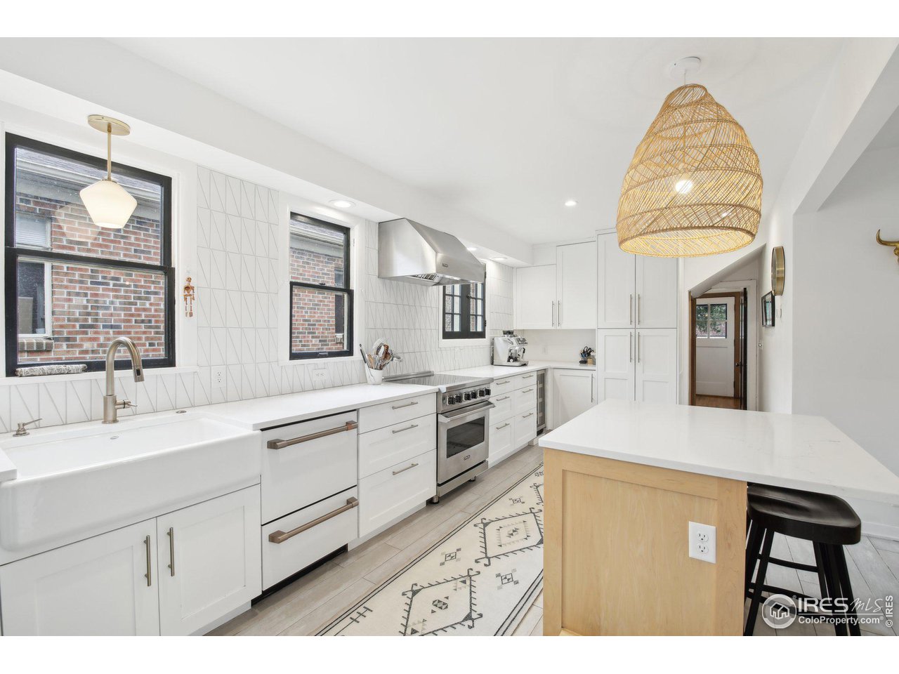 861 13th Street Boulder, CO 80302 - Photo 1 of 36 a kitchen with sink cabinets and window