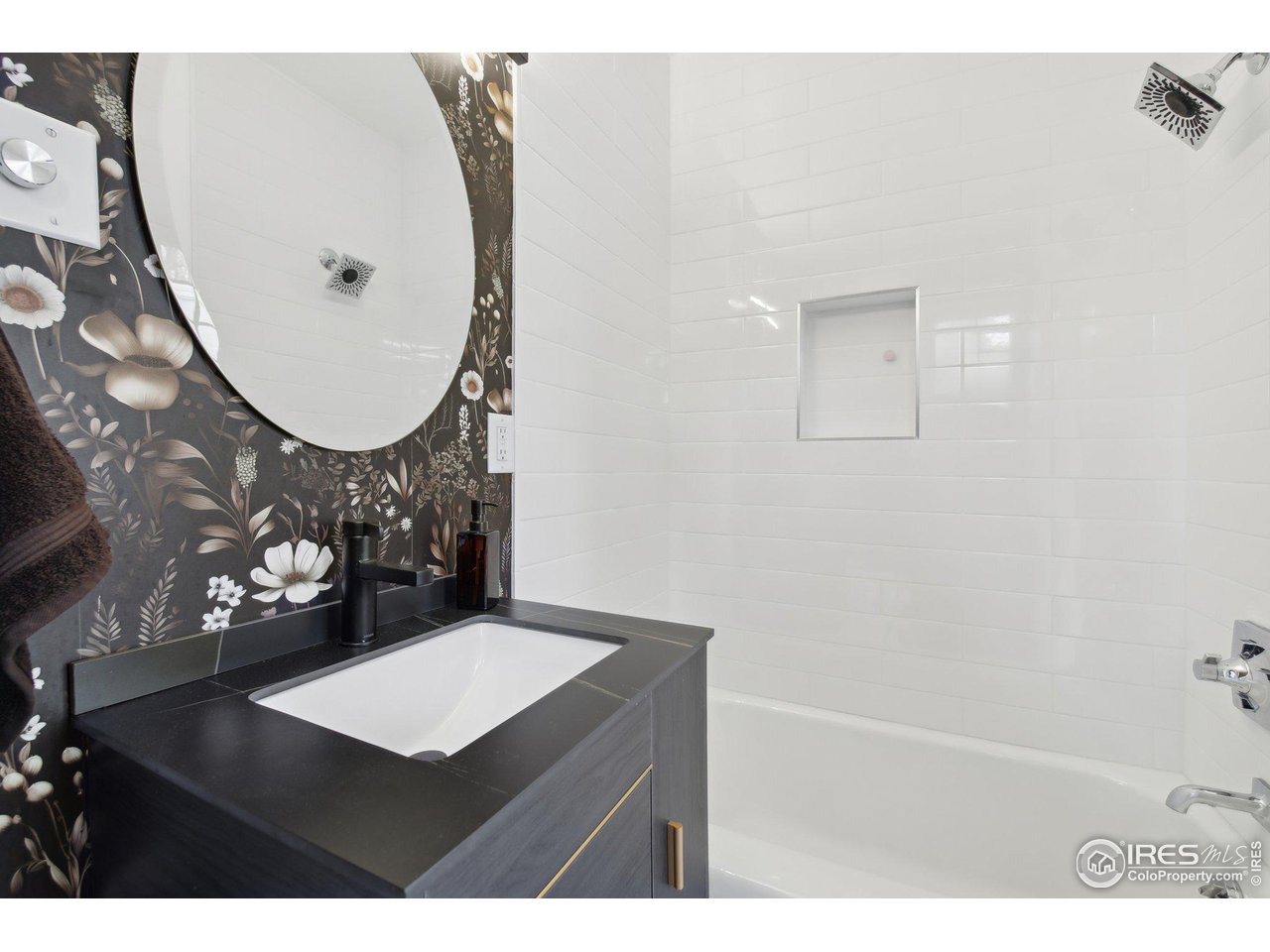 861 13th Street Boulder, CO 80302 - Photo 11 of 36 a bathroom with a sink mirror and vanity