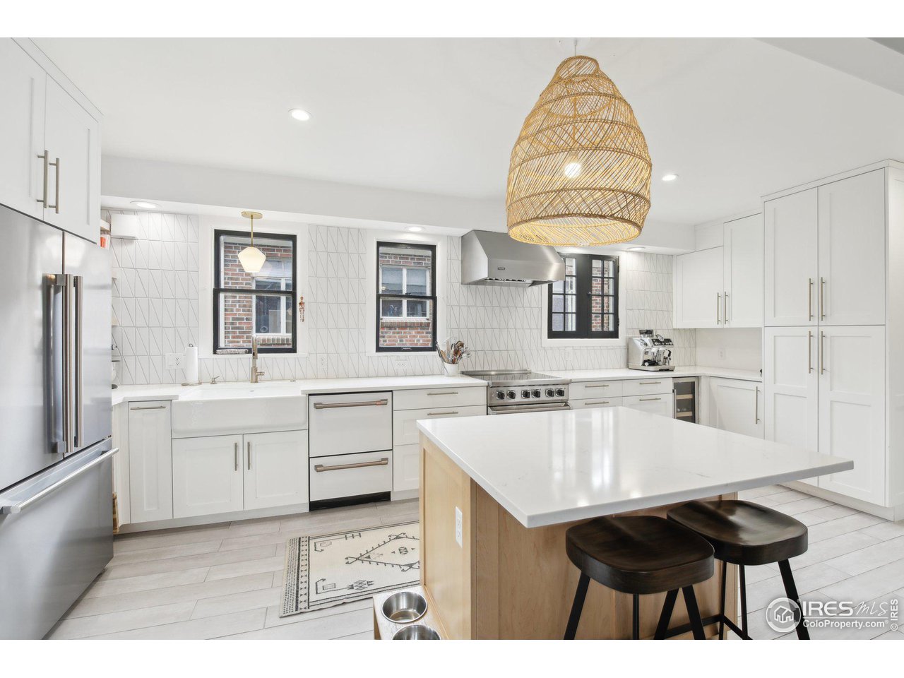 861 13th Street Boulder, CO 80302 - Photo 14 of 36 a kitchen with white cabinets and appliances