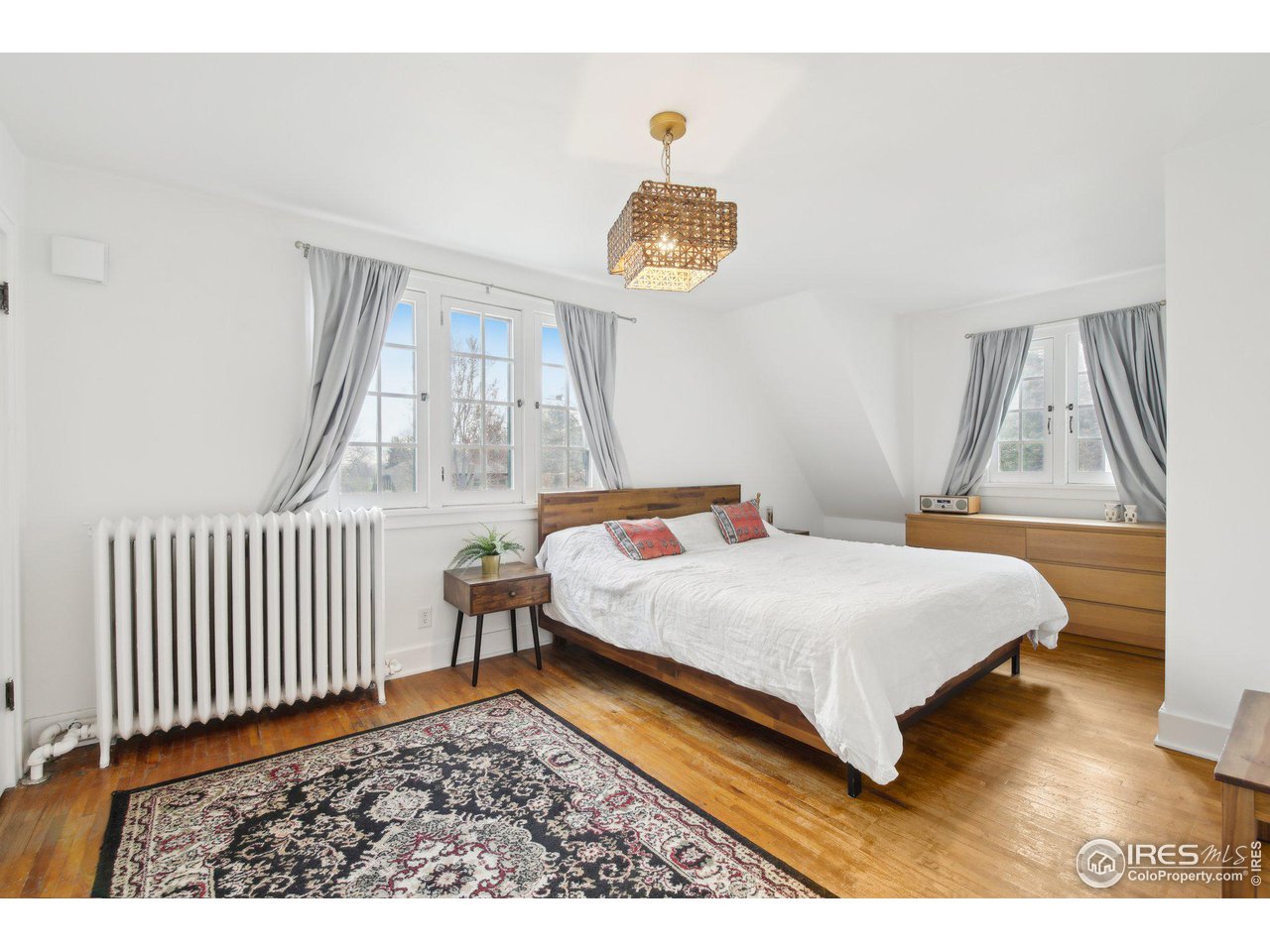 861 13th Street Boulder, CO 80302 - Photo 17 of 36 a bedroom with a bed and a window