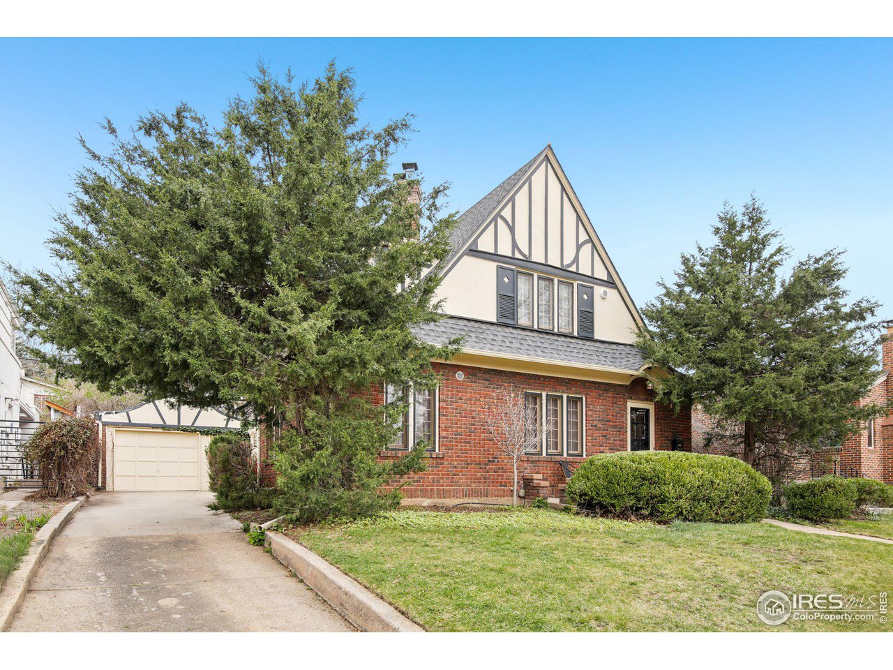 861 13th Street Boulder, CO 80302 - Photo 31 of 36 a front view of a house with a yard