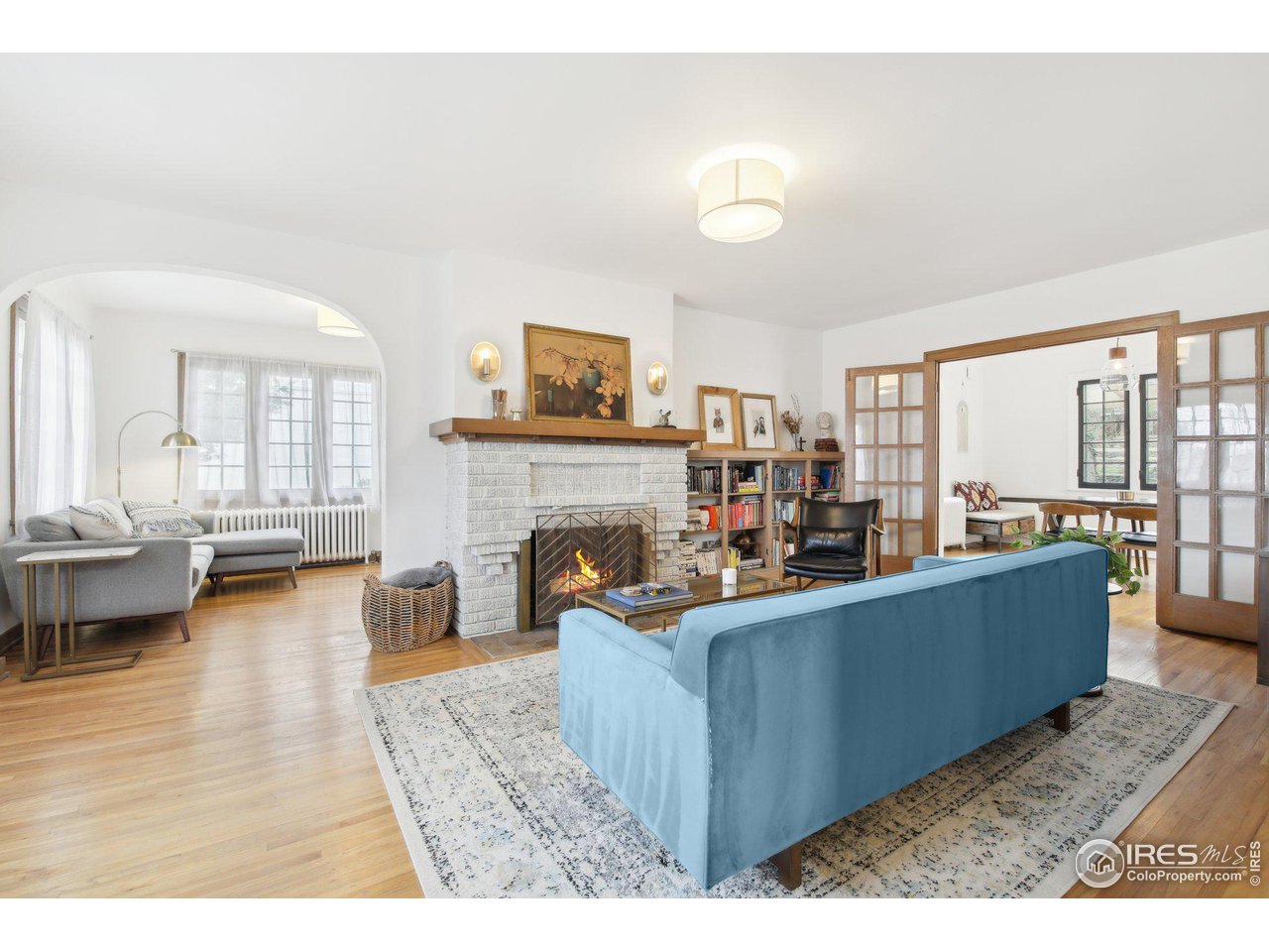 861 13th Street Boulder, CO 80302 - Photo 4 of 36 a living room with furniture a fireplace and a flat screen tv