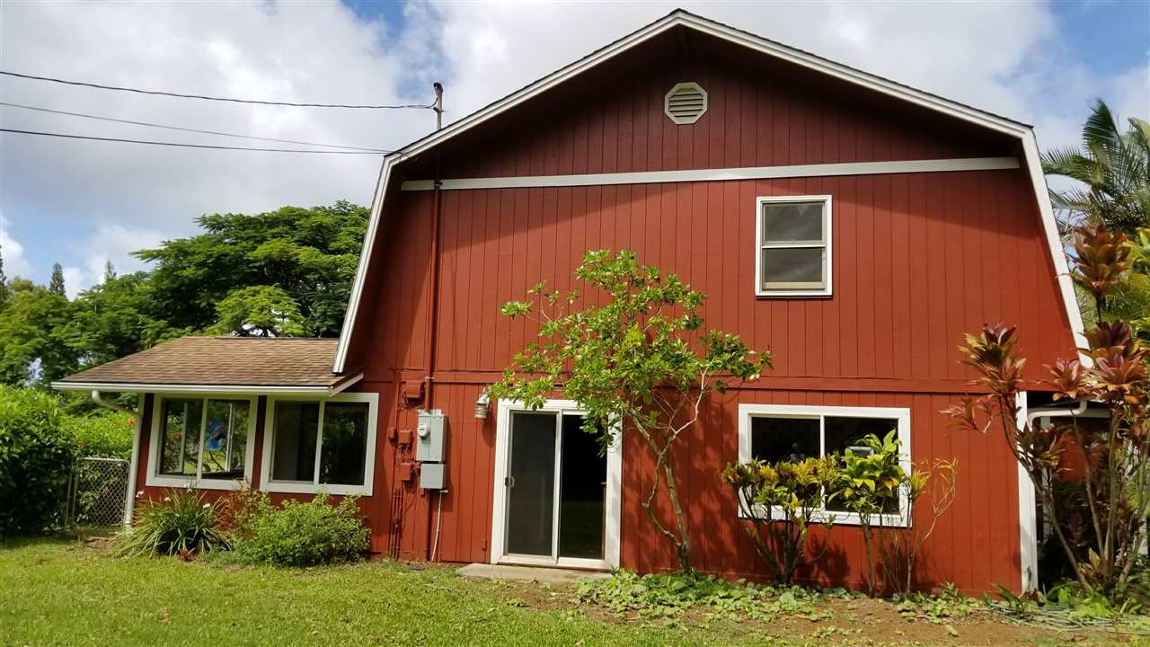 121 Oili Road Haiku, HI 96708 - Photo 5 of 24 a front view of a house with a yard