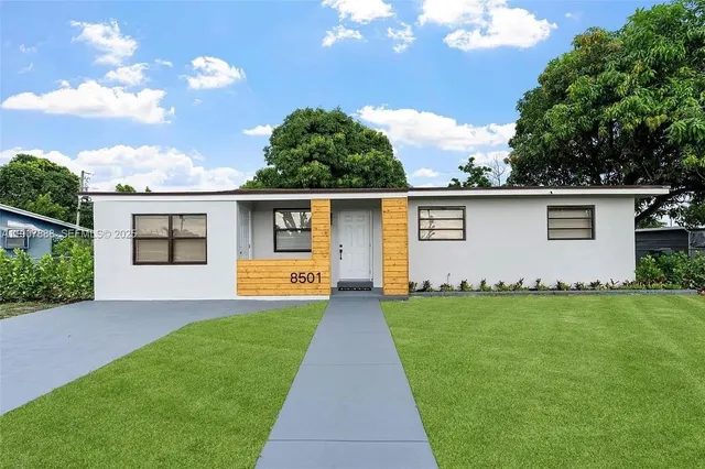 front view of a house with a yard