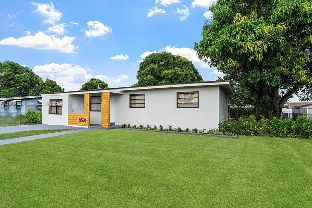 a view of a backyard of the house