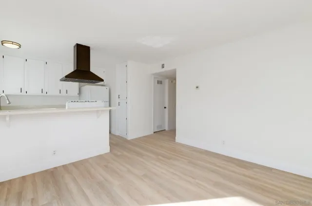 a view of a kitchen with a sink and a stove