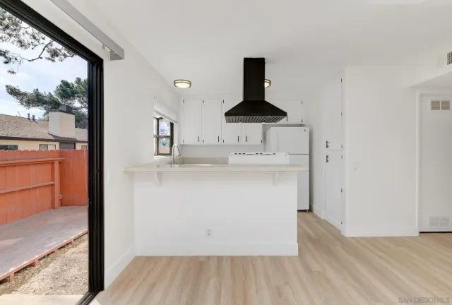 a kitchen with stainless steel appliances a refrigerator and a stove