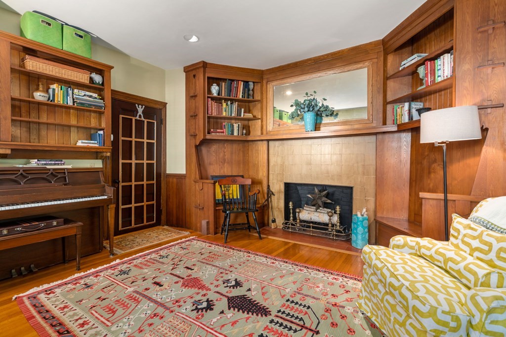 319 Sherman Street Canton, MA 02021 - Photo 11 of 29 a bedroom with furniture and a fireplace