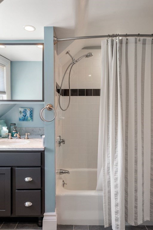 319 Sherman Street Canton, MA 02021 - Photo 22 of 29 a bathroom with a sink and a mirror