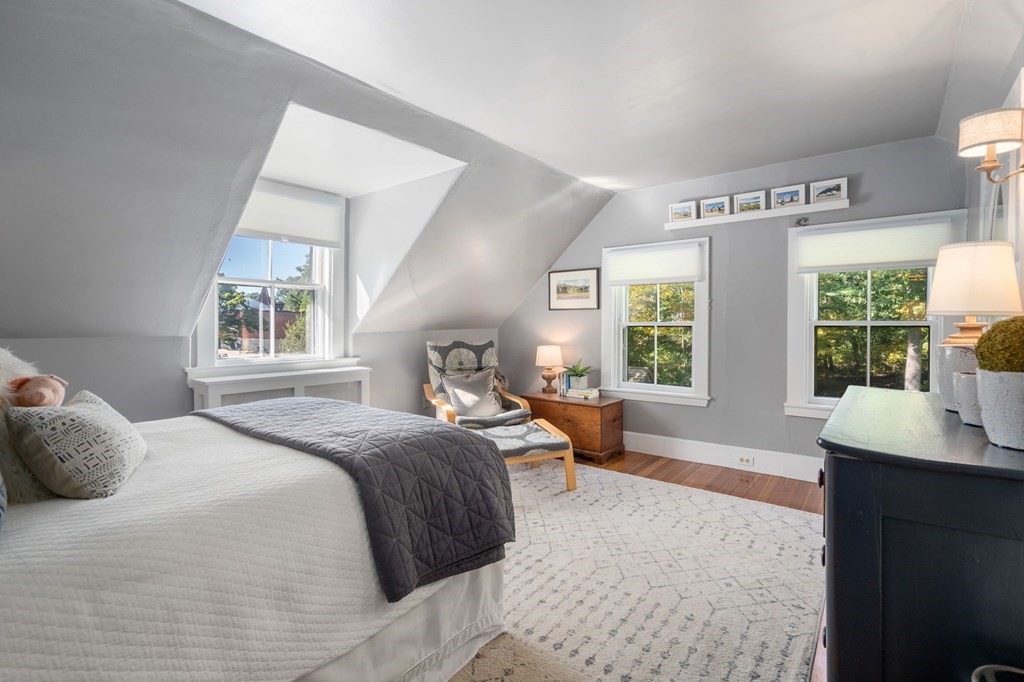 319 Sherman Street Canton, MA 02021 - Photo 23 of 29 a bedroom with a bed and large windows