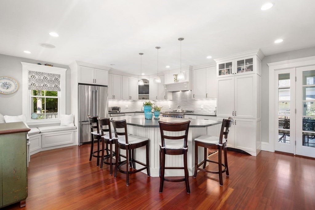 319 Sherman Street Canton, MA 02021 - Photo 3 of 29 a view of a dining room with furniture and wooden floor
