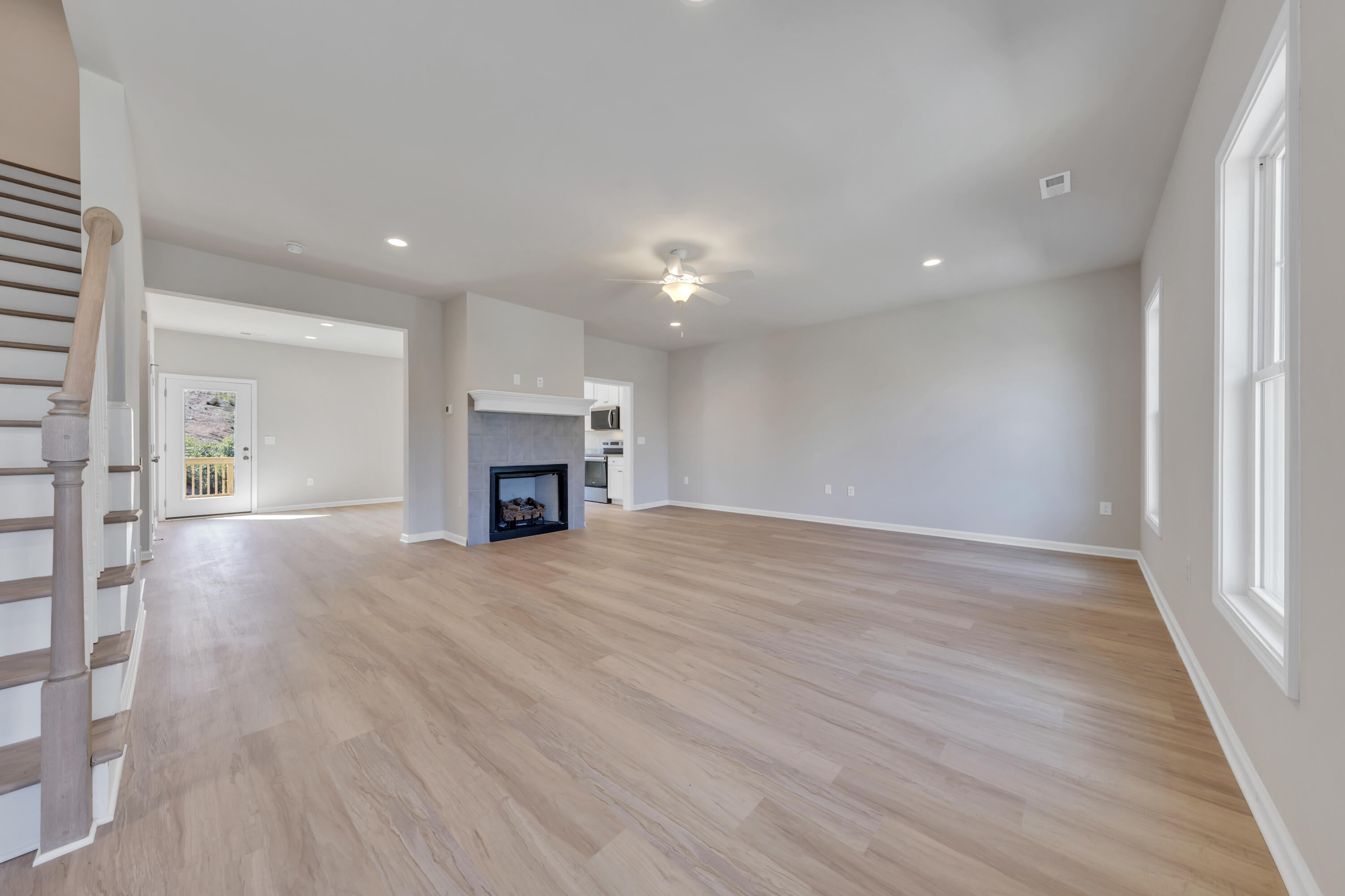 3740 Crescent Ridge Drive Southwest Roanoke, VA 24015 - Photo 6 of 25 an empty room with wooden floor and fireplace