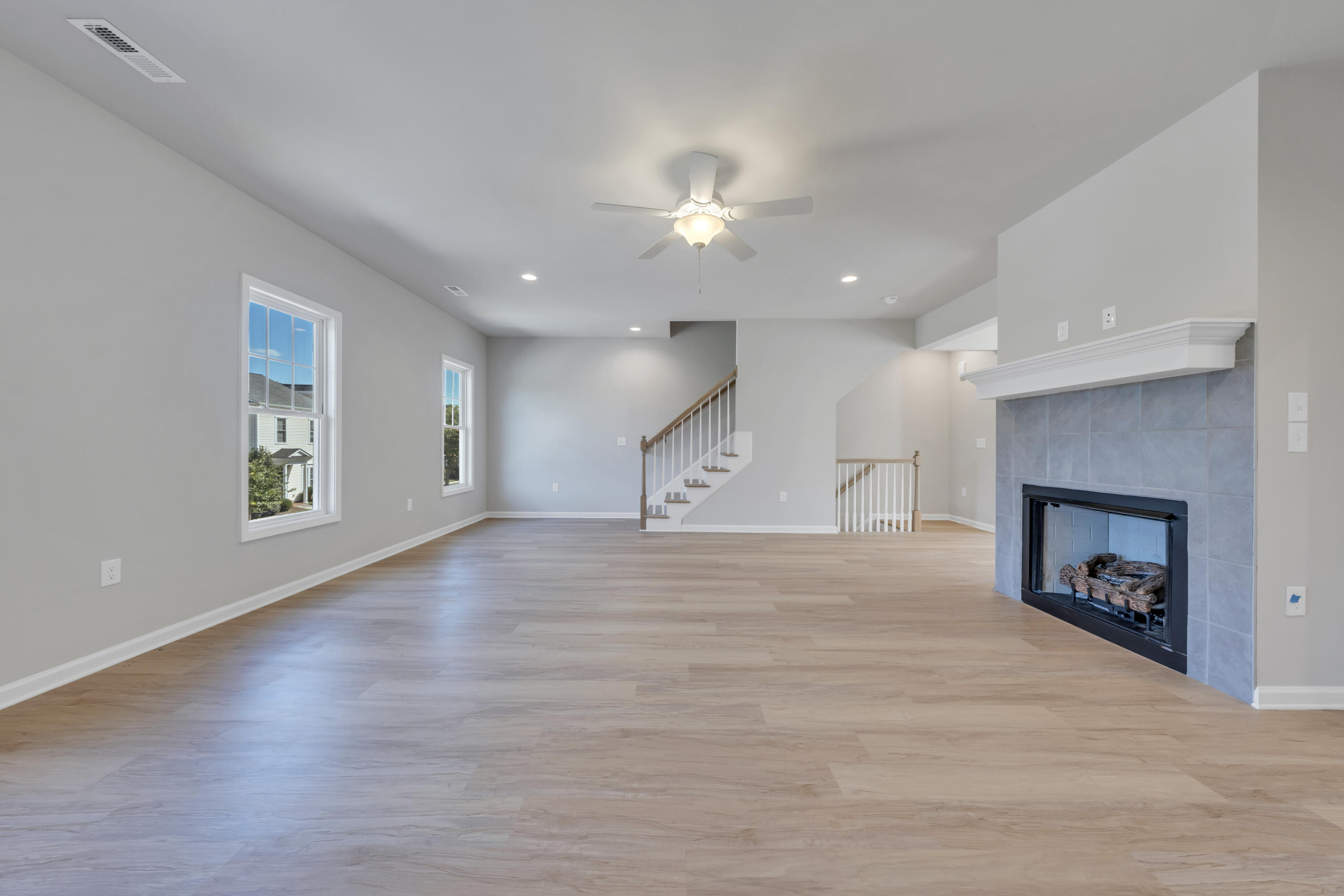 3740 Crescent Ridge Drive Southwest Roanoke, VA 24015 - Photo 7 of 25 an empty room with windows and fireplace