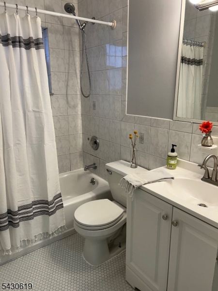 96 Grove Street Montclair, NJ 07042 - Photo 11 of 23 a bathroom with a sink toilet and shower