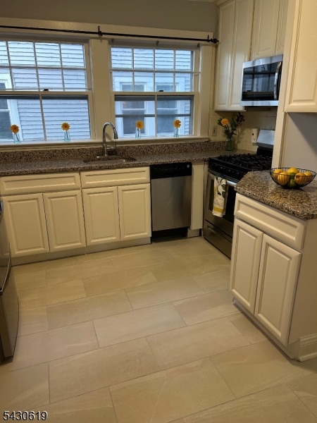 96 Grove Street Montclair, NJ 07042 - Photo 12 of 23 a kitchen with a sink and cabinets