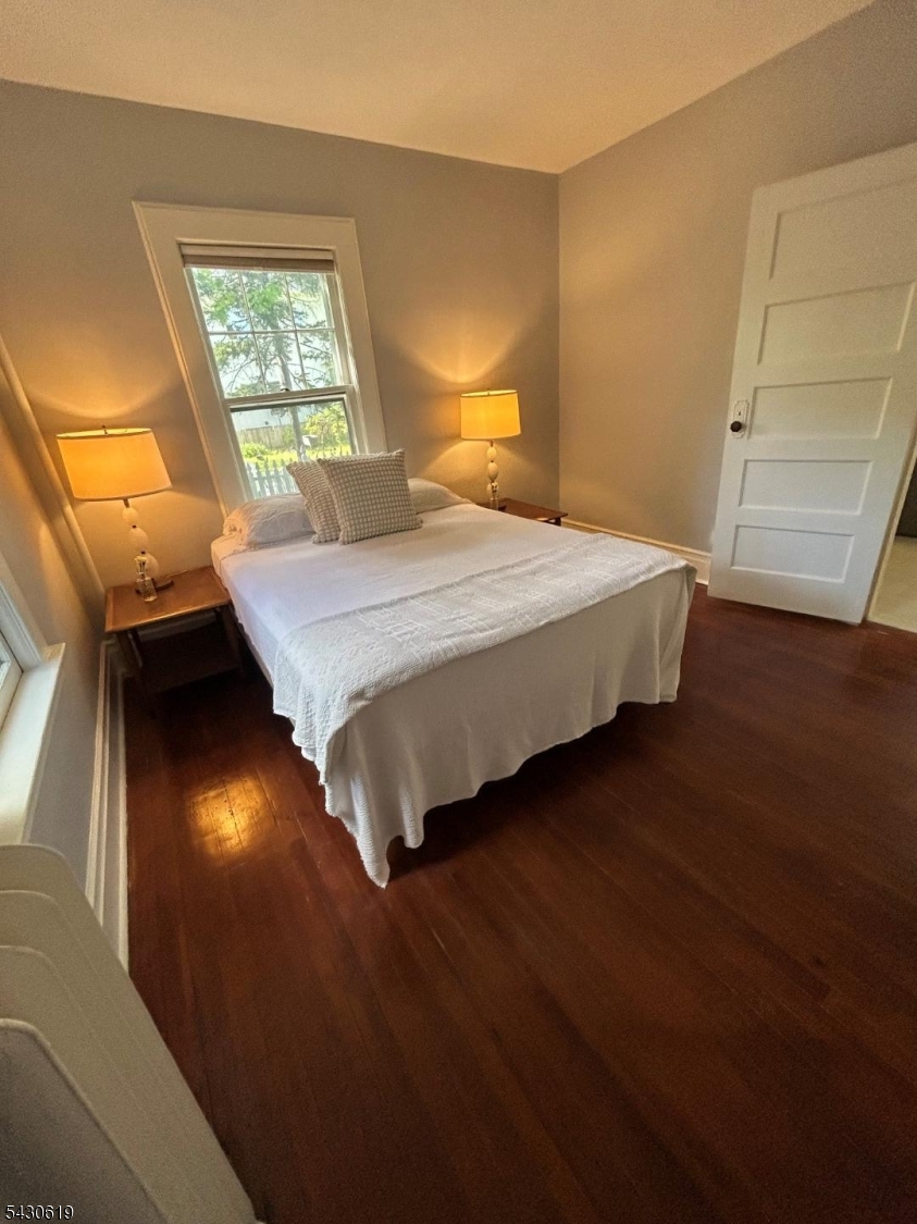 96 Grove Street Montclair, NJ 07042 - Photo 16 of 23 a bedroom with a bed and window