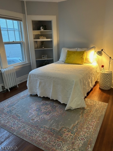 96 Grove Street Montclair, NJ 07042 - Photo 17 of 23 a bedroom with a bed and a window