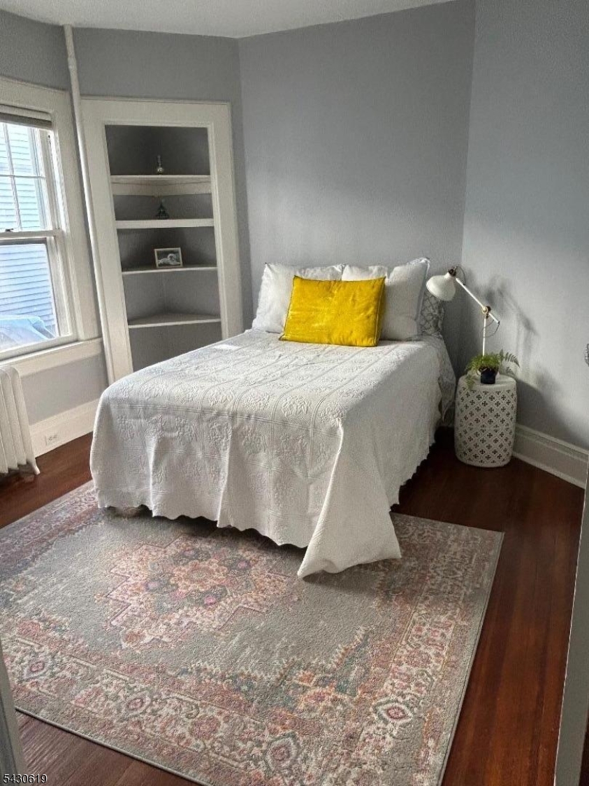 96 Grove Street Montclair, NJ 07042 - Photo 18 of 23 a bedroom with a bed and a window