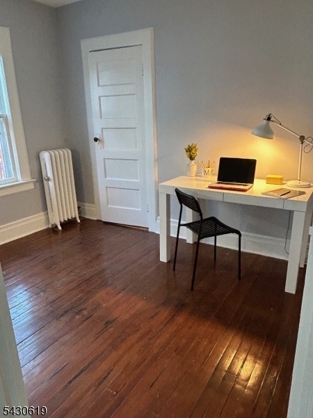 96 Grove Street Montclair, NJ 07042 - Photo 20 of 23 a workspace with furniture and wooden floor