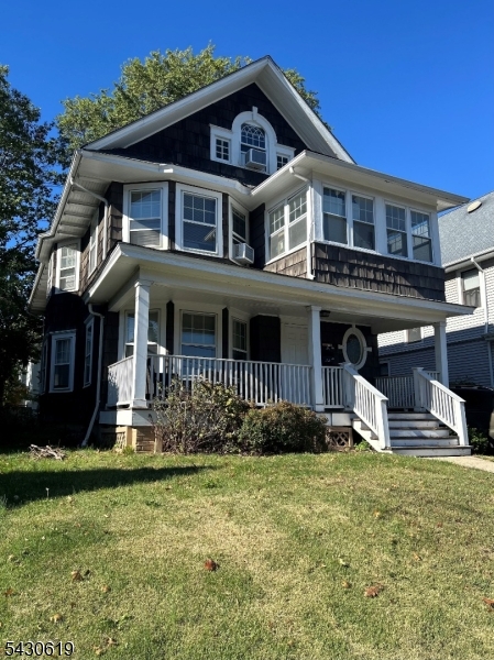 96 Grove Street Montclair, NJ 07042 - Photo 2 of 23 a front view of a house with a yard